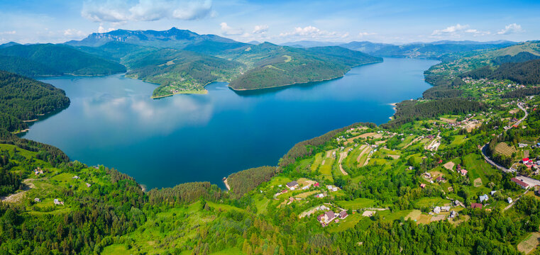Panorama of Bicaz lake and Ceahlau mountain in Romania, summer landscape