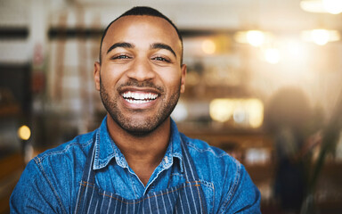 Coffee shop, restaurant and portrait of black man waiter for service, working and happy in cafe. Small business owner, barista startup and confident male worker smile in cafeteria ready to serve