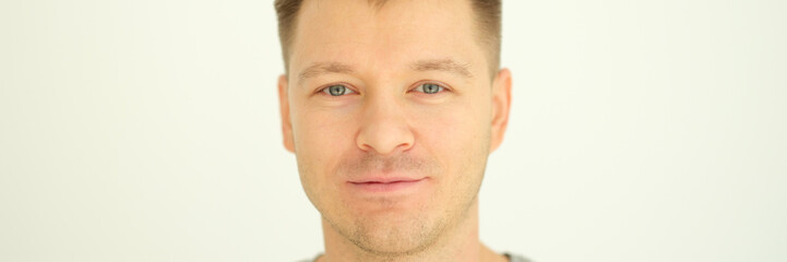 Fototapeta premium Portrait of young healthy man with stylish haircut. Healthy lifestyle concept