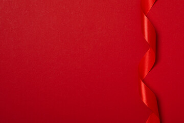 Concept of different ribbons, red ribbon on red background