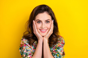 Naklejka premium Photo of stunning positive lady arms touch cheeks beaming smile isolated on yellow color background