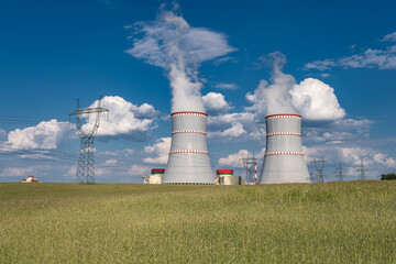 Fototapeta na wymiar Cooling towers of nuclear power plant against the blue sky