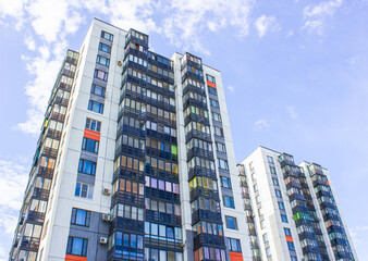 Fototapeta premium Architectural design of apartment buildings. External view of a new building, residential building, apartments. Modern houses, apartments.Facade of a high-rise apartment