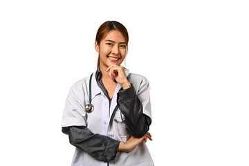 Cheerful young female doctor in white coat with stethoscope smiling at camera isolated on white background. Healthcare concept