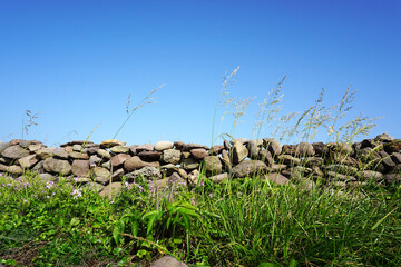 a stone wall and sky