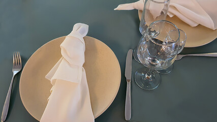 Festive table setting in the restaurant. Wedding preparations. Selective focus.