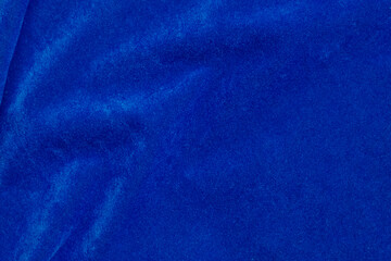 blue velvet fabric texture used as background. blue fabric background of soft and smooth textile material. There is space for text..