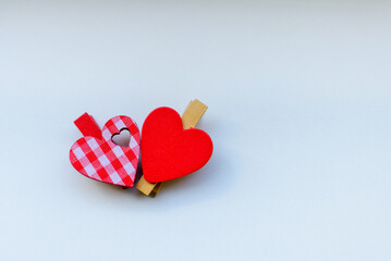 Two red wooden heart flat lay.Couple red little hearts on white surface with copy space.14th february.Copy space.