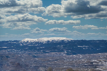 snowy mountain peak on a cloudy day