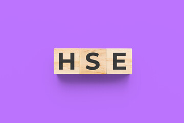 HSE (Health Society and Environment) wooden cubes on purple background