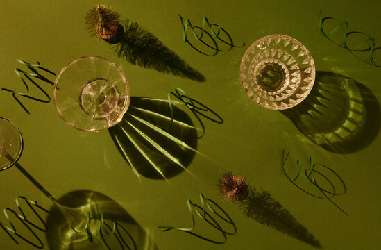 Green paper streamers around wineglasses