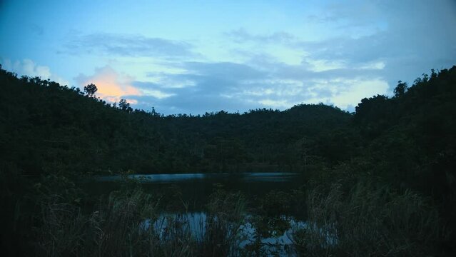 Mangrove swamp lake between two hills on a late afternoon in the Philippines