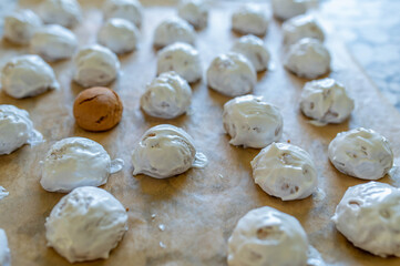Russian gingerbread cookies with egg white glaze on a baking sheet
