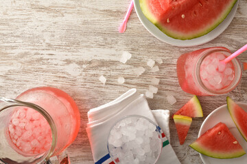 Watermelon refreshment with ice on table top view