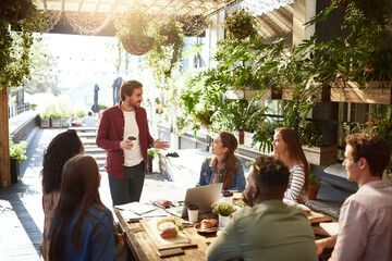 Presentation, restaurant and business people in meeting for discussion, planning and communication....
