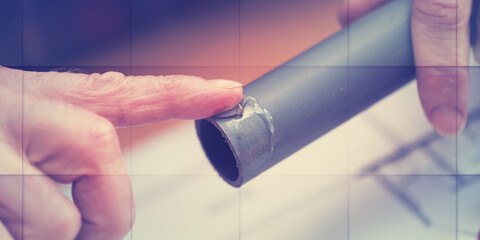 Plumber applying glue on pvc pipe, geometric pattern