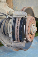 replaced new brake pads on the disc,installation of brake pads on an old disk, repair of car brakes