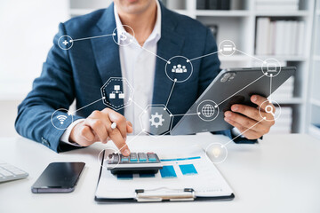 Investors are calculating on calculator investment costs and holding tablet in hand.