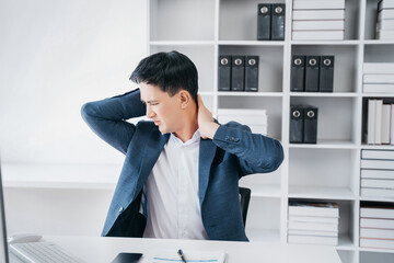 Naklejka premium Businessman sitting at home office workplace gesture neck pain office syndrome concept.