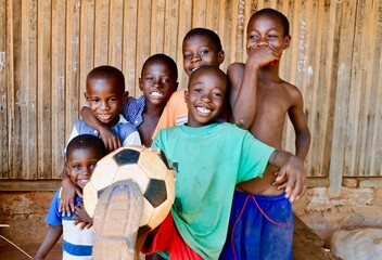 A group of boys have fun playing soccer