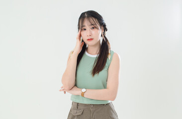 Portrait isolated cutout studio shot of Asian young cool female teenage fashion model with pigtails braids hairstyle in casual trendy shirt shorts standing posing look at camera on white background