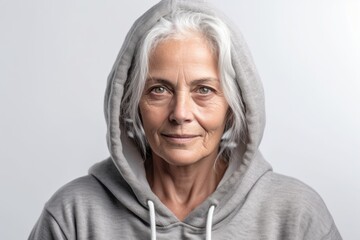 Medium shot portrait photography of a tender mature woman wearing a comfortable hoodie against a white background. With generative AI technology