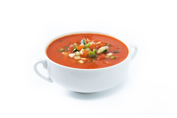 Traditional Spanish gazpacho soup in bowl isolated on white background