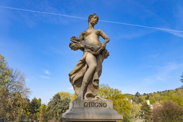 Obraz premium TURIN, ITALY, APRIL 11, 2023 -The statue of the mounth of June in the fountain of the 12 months near Valentino Park in Turin (Torino), Piedmont, Italy