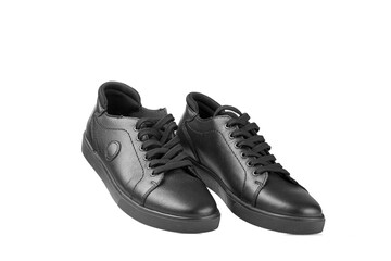 black leather sneakers on a white background