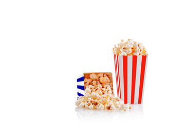 Glass with popcorn on a white background