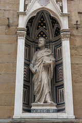 Fototapeta na wymiar Statue of Saint Peter in the Exterior Tabernacle in the Exterior Perimeter of the Church of Orsanmichele in Florence, Italy