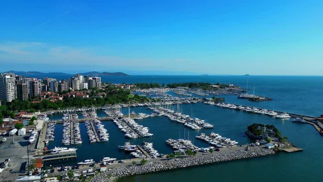 yacht parking in the bay in the blue water Istanbul Türkiye Fenerbahce -  stock Aerial flying drone video