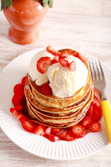 Pile of pancakes with ice cream