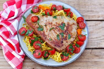 Fried tuna fish steak with salad