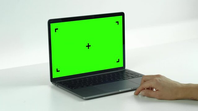 Empty Green Screen DisplayLaptop Swipe Left Single on a White Background. Green Mock-up Monitor for Video Call, Website Template Presentation or Game Applications. Blank Screen Monitor 3D render.
