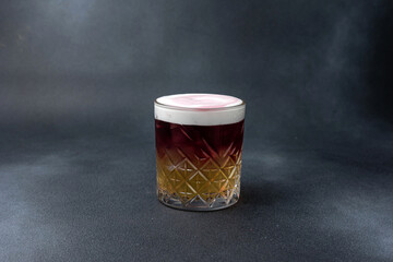 Delicious alcoholic cocktail on a dark background