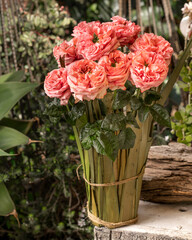 Contrasting Elegance: Red Rose Floral Arrangement on a Blue Chair