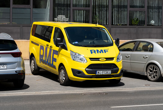 RMF FM radio station broadcasting car. Polish commercial radio network station yellow vehicle with logo sign on June 4, 2023 in Krakow, Poland.