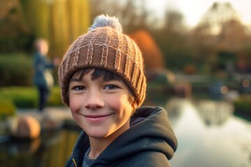 Close-up portrait photography of a grinning mature boy wearing a warm beanie or knit hat against a tranquil koi pond background. With generative AI technology