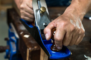 Close up construction worker using tools in construction site
