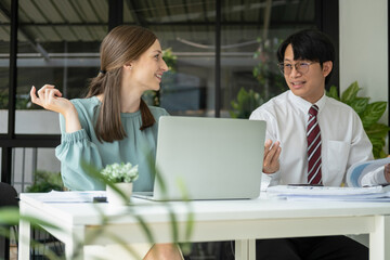 Fototapeta premium Businessmen working together at desk.