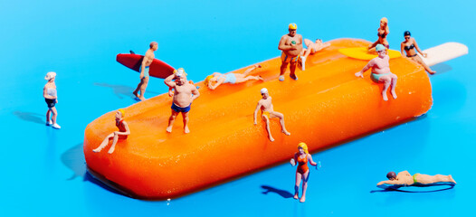 miniature people on a popsicle, banner format - 611281661