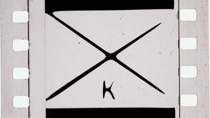Film Artifact with Cross Element