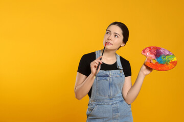 Woman with painting tools on yellow background, space for text. Young artist