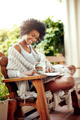 Black woman, reading and backyard patio with book and coffee feeling relax and happy. Happiness,...