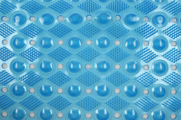 Polyvinyl chloride blue bathroom rug, top view with massage effect