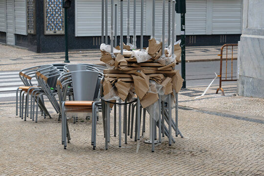 Stacked Chairs And Tables At A Closed Restaurant