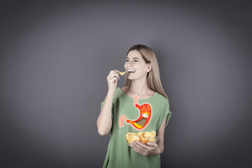 Improper nutrition can lead to heartburn or other gastrointestinal problems. Woman eating potato...