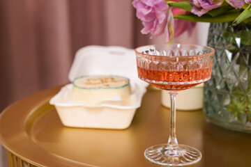 Glass of delicious wine on table indoors, closeup. Space for text