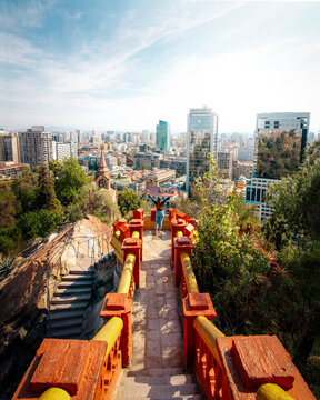 The tourist observes the impressive aerial views of downtown Santiago at the View Point of Santa Lucia Hill.